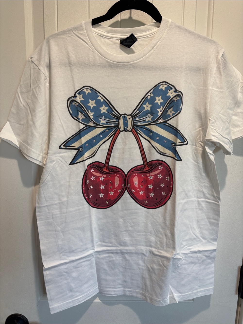 J Coons White Tee with Blue Star Bow and Red Cherry Graphic
